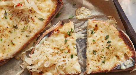 Welsh rarebit with smoked chipotle sauerkraut on a baking tray